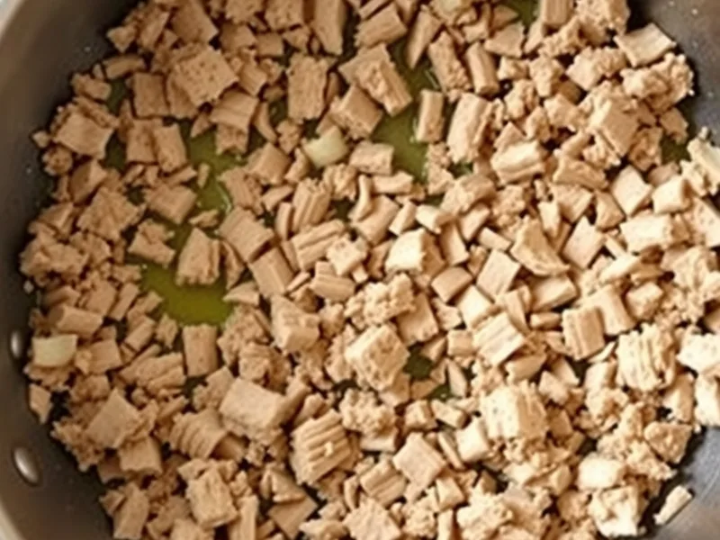Browned crumbled ground turkey and small pieces of onion in a pan with a little oil